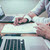 businessmen reviewing costs